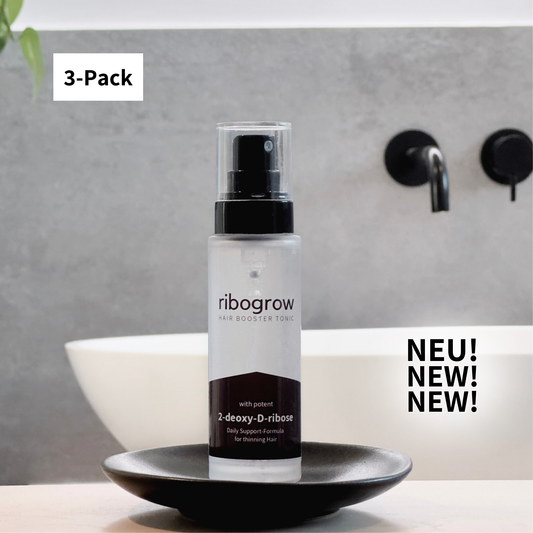 Zeigt das ribogrow HAIR BOOSTER TONIC gegen Haarausfall mit 2-Desoxy-D-Ribose im Badezimmer mit einem "NEU" Icon sowie einem 3-Pack-Icon
https://ribogrow.com/products/ribogrow-hair-booster-tonic
