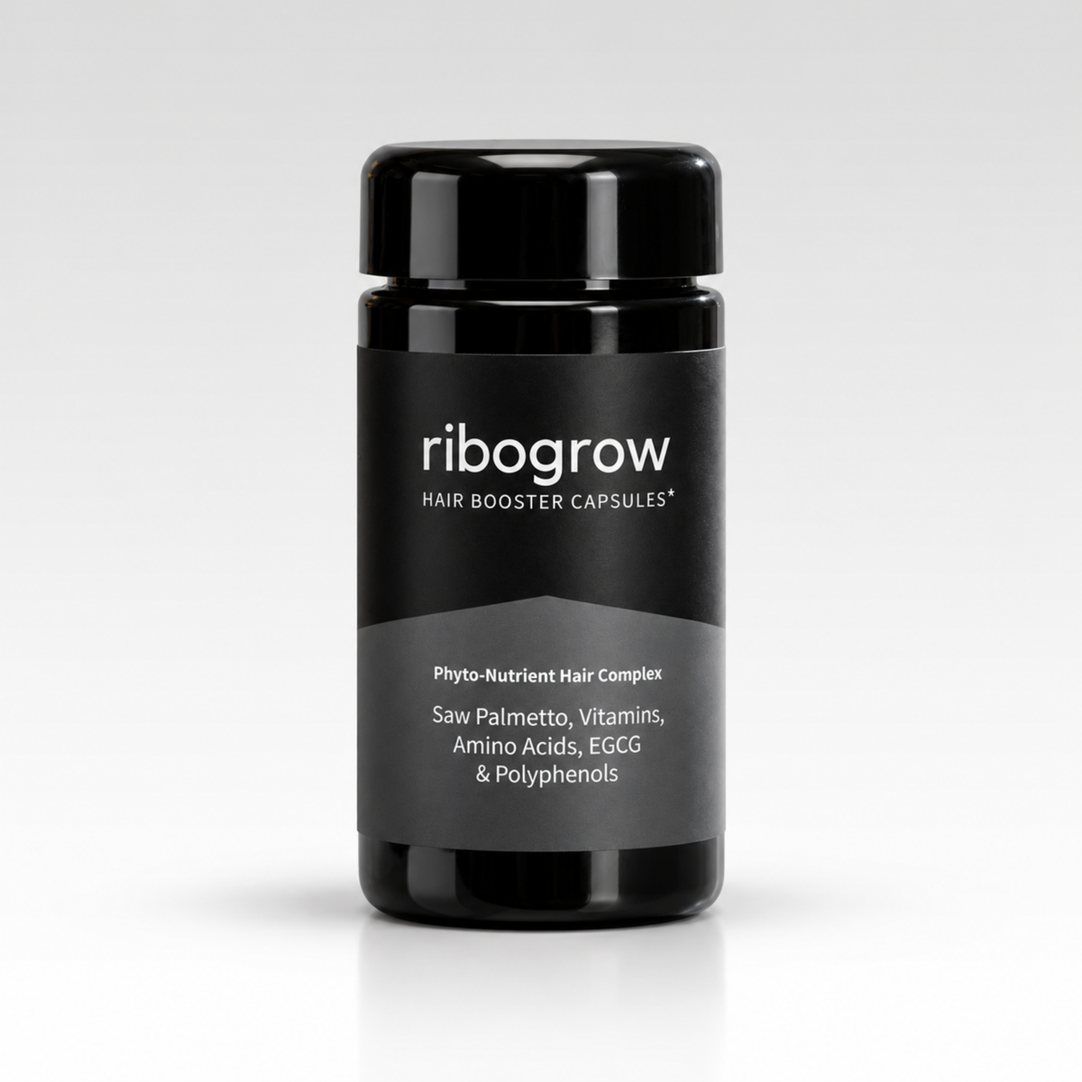 Schwarze Dose ribogrow® Hair Booster Capsules mit glänzendem Schraubdeckel und zweifarbigem Etikett in Schwarz und Grau. Die Beschriftung zeigt den Phyto-Nährstoff-Komplex mit Sägepalme, Vitaminen, Aminosäuren, EGCG und Polyphenolen. Die Dose steht mittig auf einer weißen, leicht spiegelnden Oberfläche vor einem hellgrauen Hintergrund.