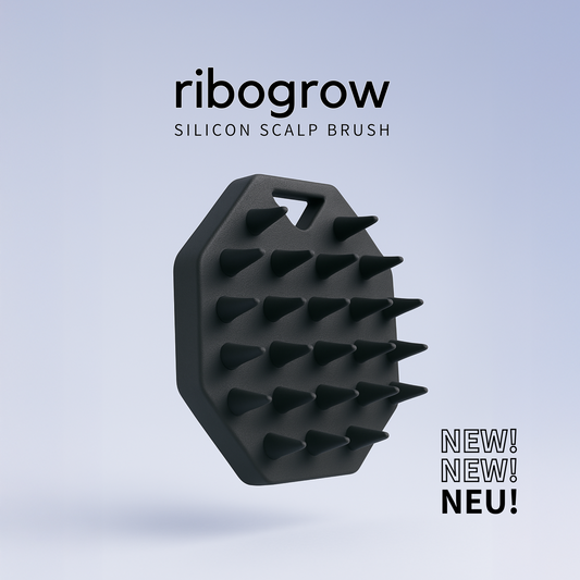 Showing the ribogrow silicone scalp brush back side. A scalp massager and a sleek, ergonomic hair tool designed to boost blood circulation, exfoliate the scalp, and promote healthy hair growth. Perfect for daily use in the shower or with the ribogrow Hair Booster Serum.