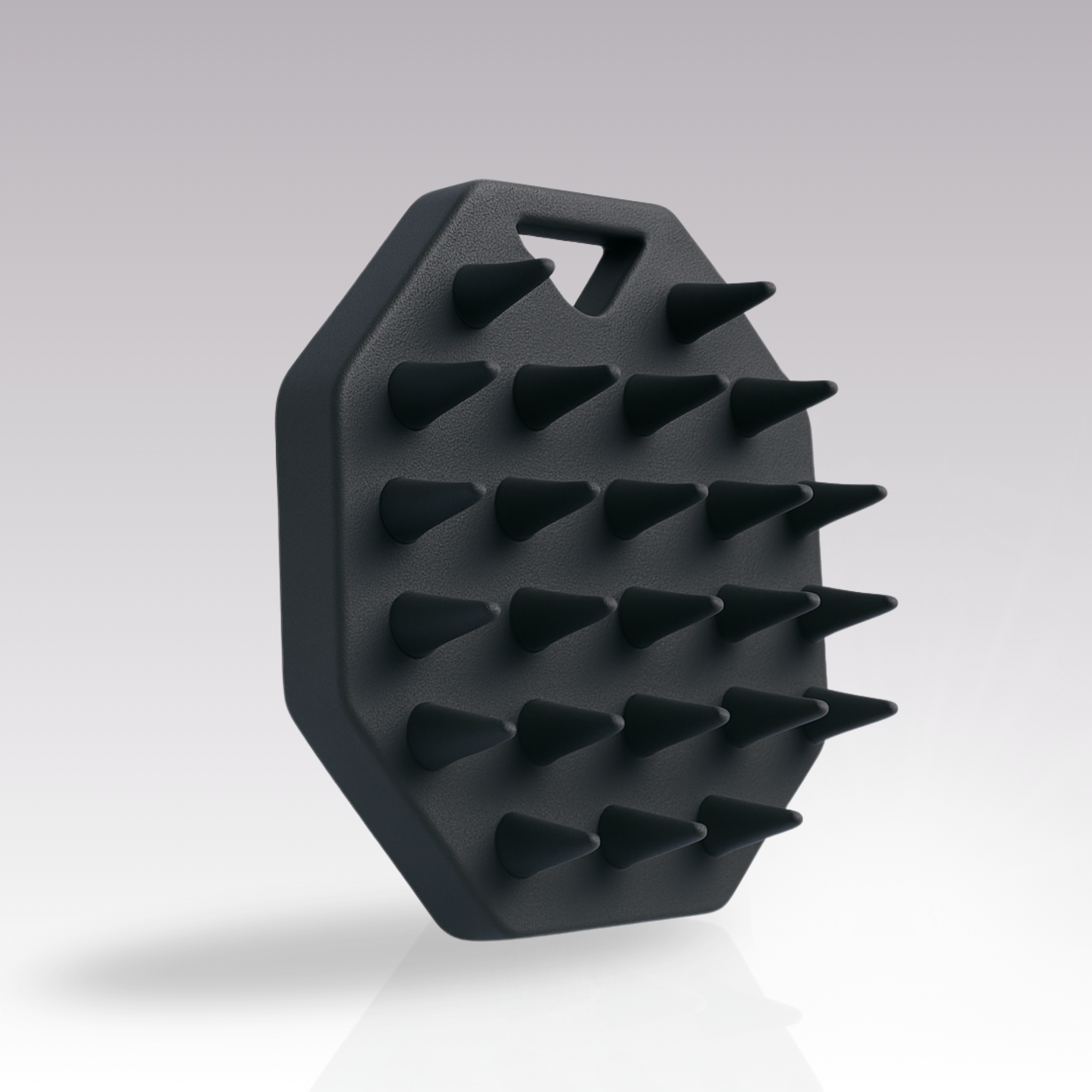 Zeigt die ribogrow Silikon-Kopfhautbuerste vor einem grauen Hintergrund